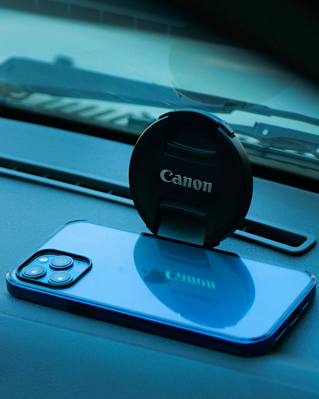 a cell phone sitting on top of a car dashboard