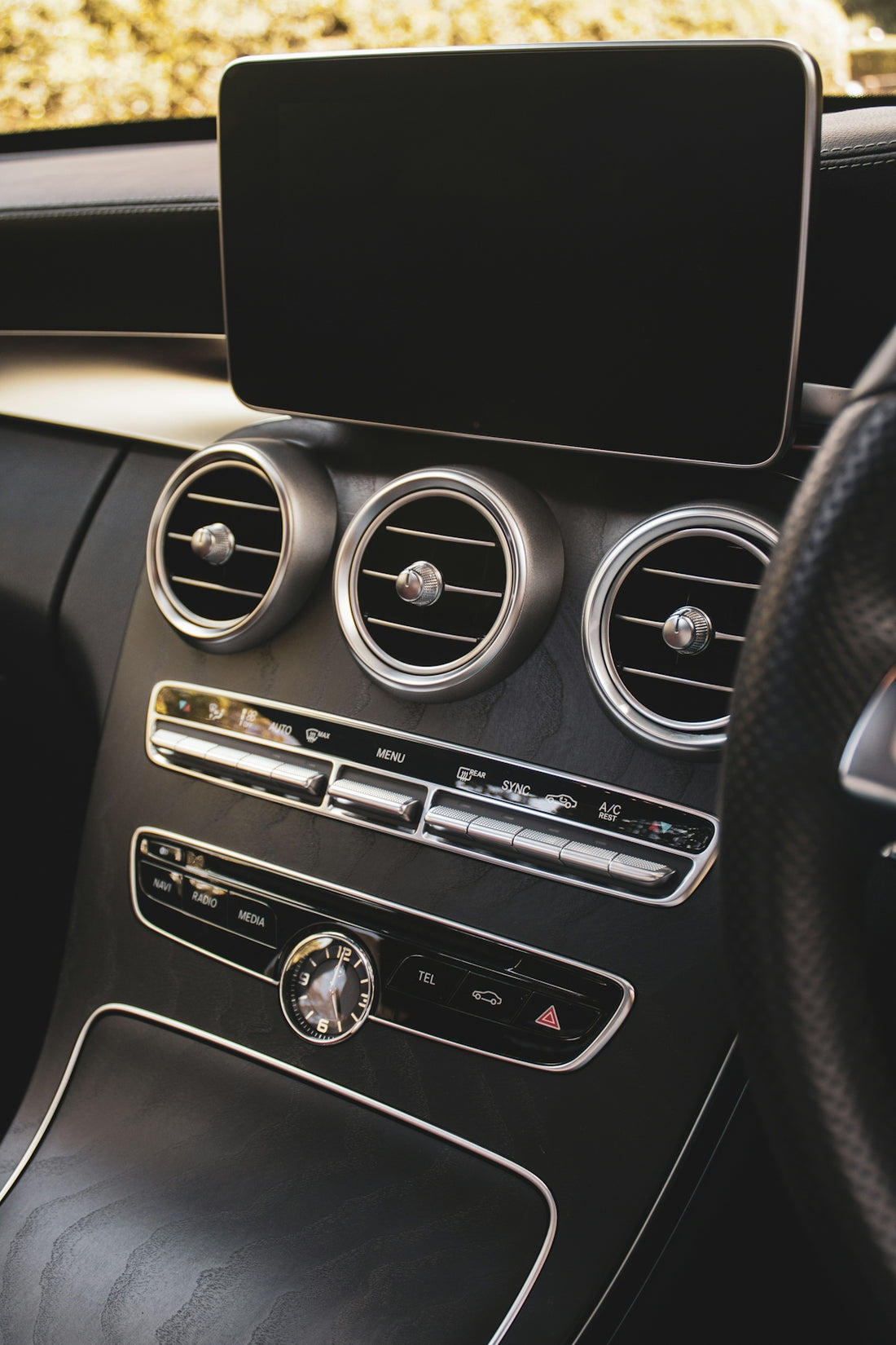 a car dashboard with a black speaker