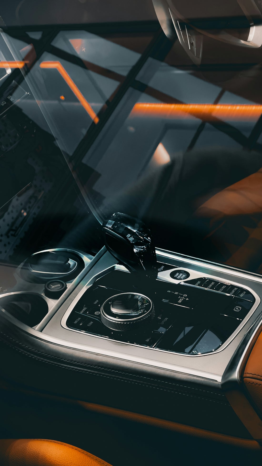 a car dashboard with a steering wheel and dashboard controls
